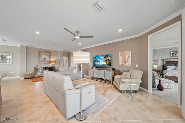 living room with ceiling fan, ornamental molding, and light tile patterned floors