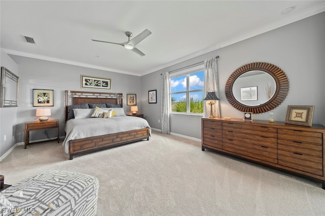 bedroom featuring crown molding, light carpet, and ceiling fan