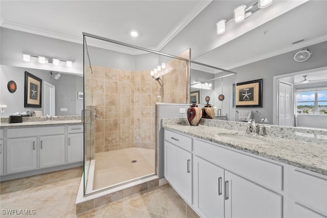 bathroom with an enclosed shower, ceiling fan, vanity, ornamental molding, and tile patterned flooring