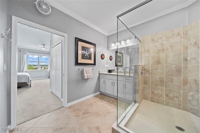 bathroom featuring vanity, crown molding, walk in shower, and tile patterned flooring