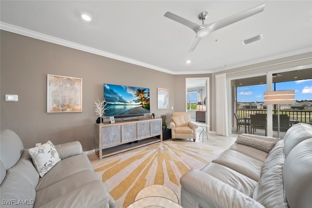 living room featuring ceiling fan and ornamental molding