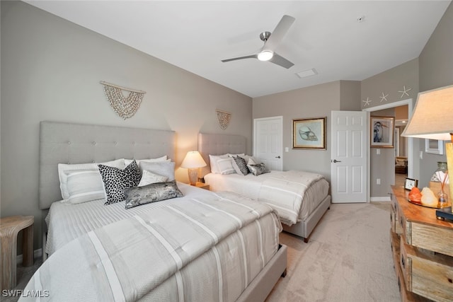 bedroom featuring ceiling fan and light carpet