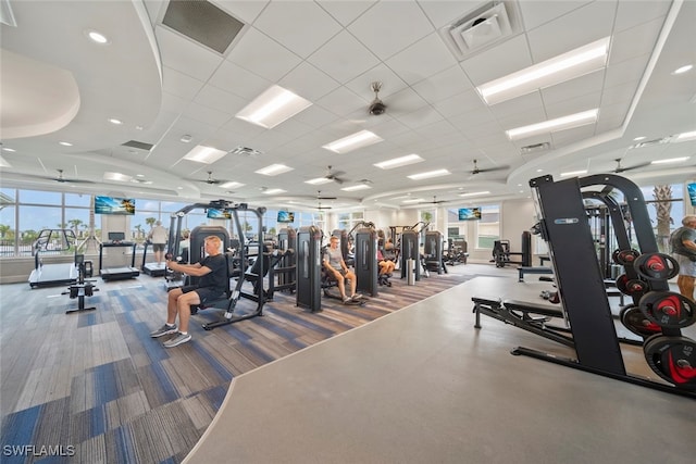 workout area featuring a drop ceiling and carpet floors