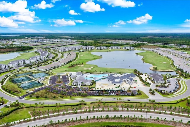 birds eye view of property with a water view