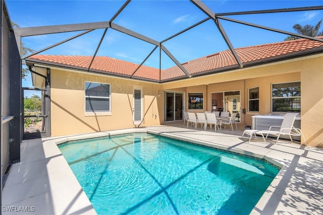 view of pool featuring a patio area and a lanai