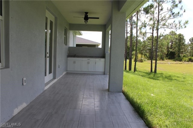 view of patio / terrace with sink and ceiling fan