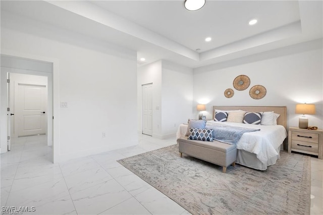 bedroom featuring a raised ceiling