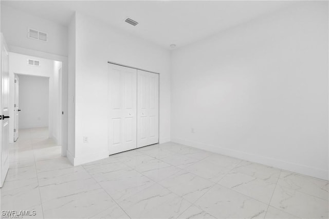 unfurnished bedroom featuring a closet