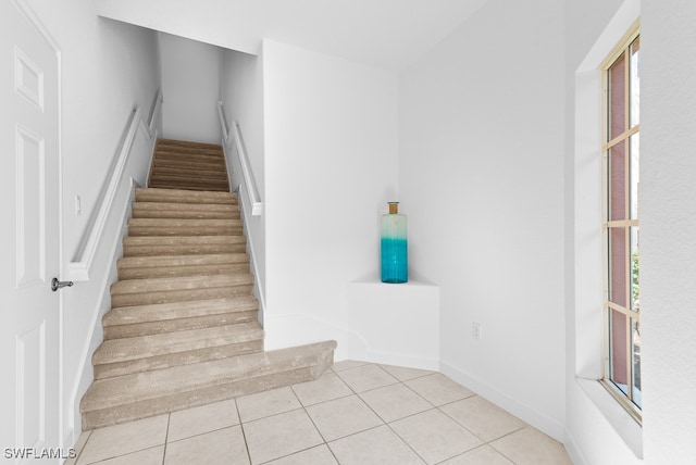 staircase with tile patterned flooring