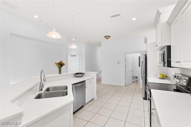 kitchen with sink, hanging light fixtures, stainless steel appliances, white cabinets, and light tile patterned floors