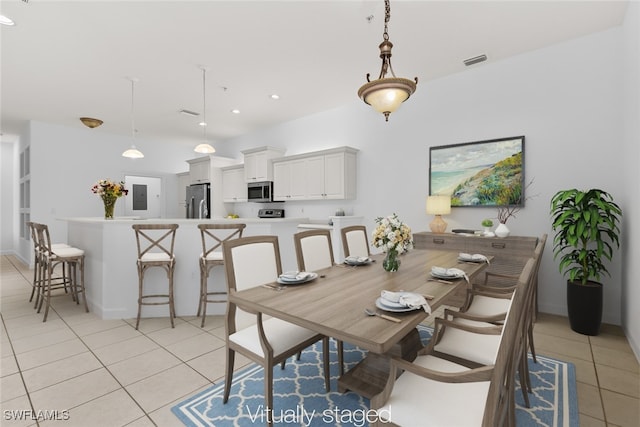 dining space featuring electric panel and light tile patterned floors