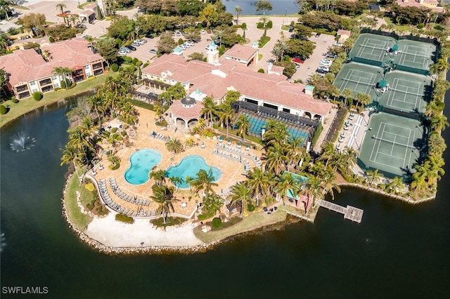 birds eye view of property with a water view