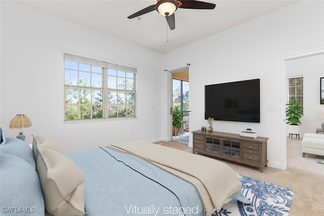 carpeted bedroom with ceiling fan