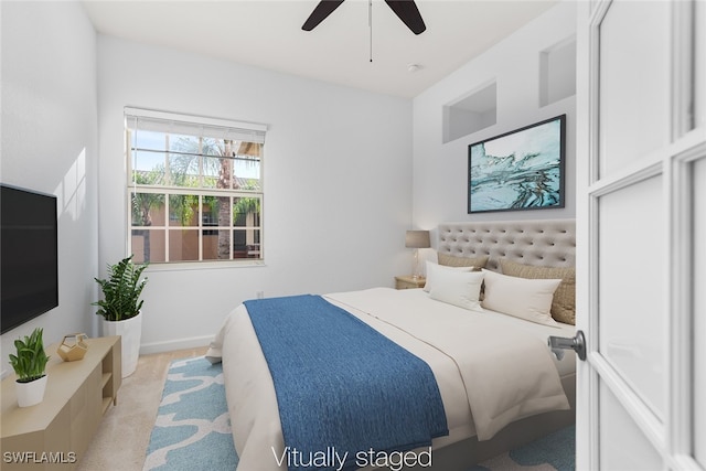 bedroom with light colored carpet and ceiling fan