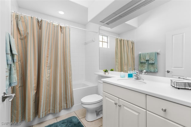 full bathroom with toilet, shower / bath combo, vanity, and tile patterned floors