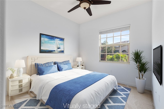 carpeted bedroom with ceiling fan