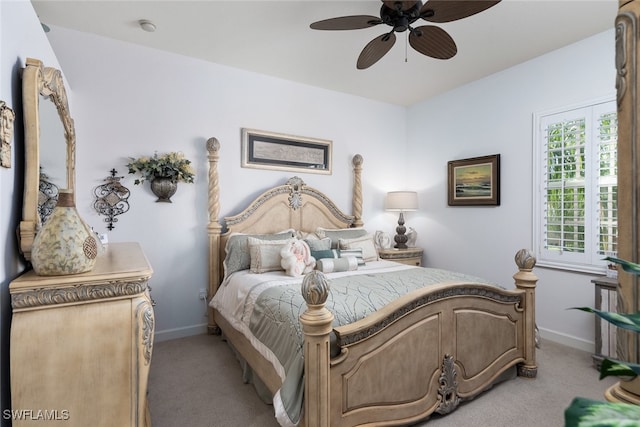 bedroom with ceiling fan and light colored carpet