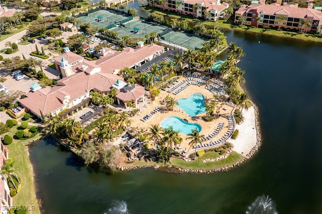 birds eye view of property with a water view