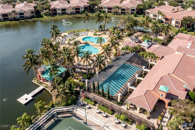 birds eye view of property with a water view