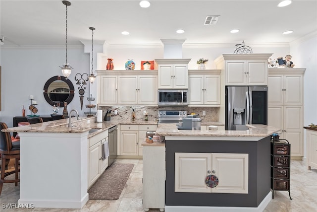 kitchen with appliances with stainless steel finishes, a center island, kitchen peninsula, decorative light fixtures, and a breakfast bar