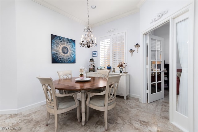 dining area with crown molding and a chandelier