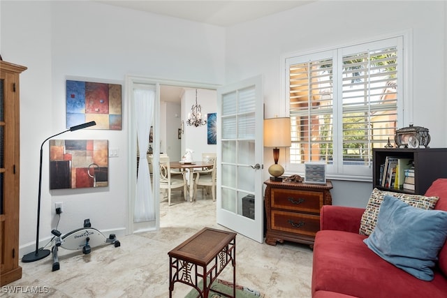 sitting room with french doors and a healthy amount of sunlight