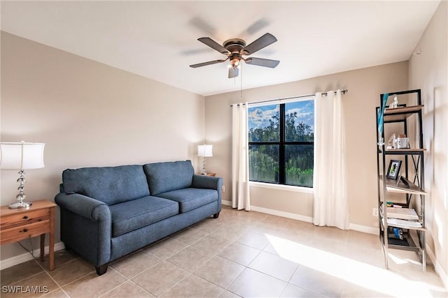 tiled living room featuring ceiling fan