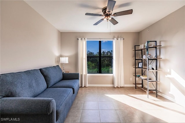 tiled living room with ceiling fan