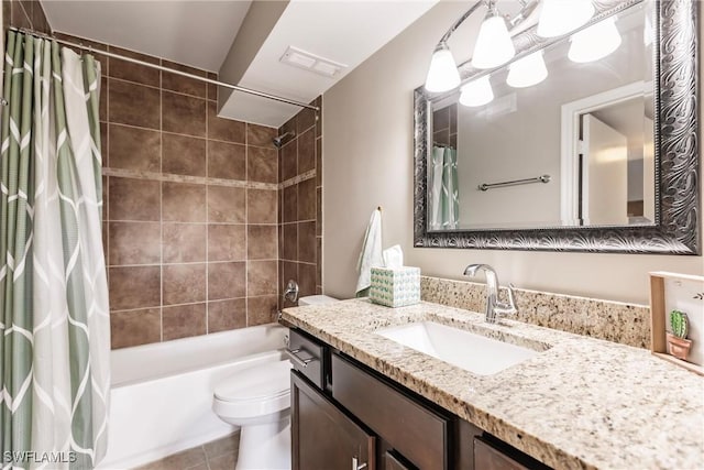 full bathroom featuring tile patterned floors, vanity, toilet, and shower / tub combo