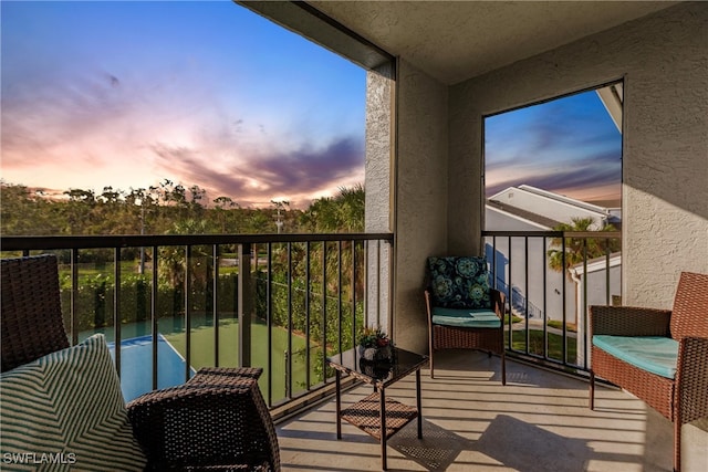 view of balcony at dusk