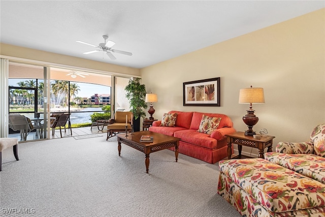 carpeted living room with ceiling fan