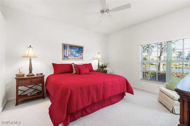 bedroom with ceiling fan and carpet floors