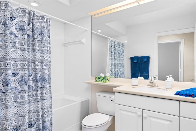 full bathroom featuring vanity, toilet, and shower / bath combination with curtain