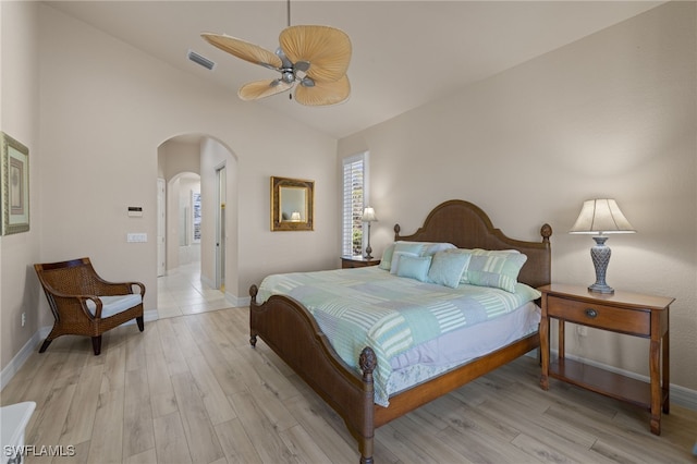 bedroom featuring ceiling fan, light hardwood / wood-style flooring, and vaulted ceiling