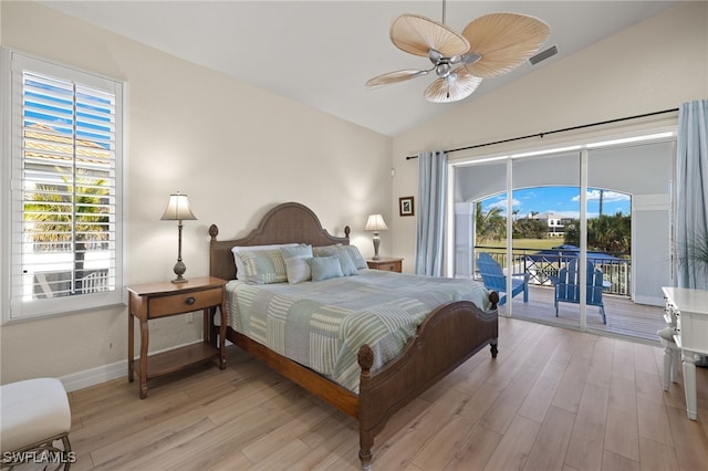 bedroom with ceiling fan, light hardwood / wood-style floors, access to exterior, and vaulted ceiling