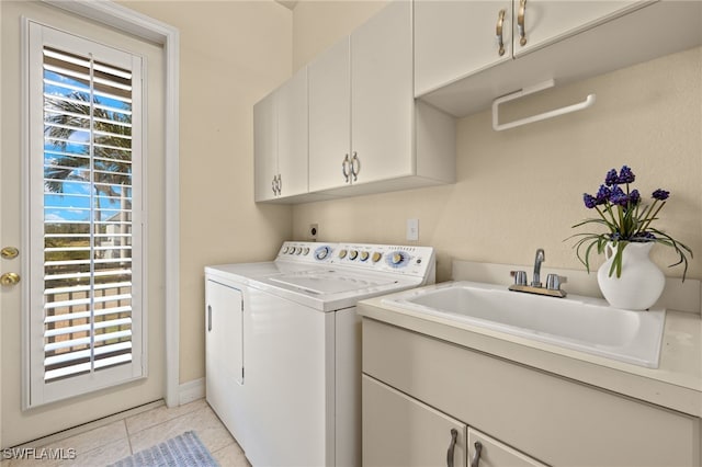 washroom with cabinets, light tile patterned floors, a wealth of natural light, and sink