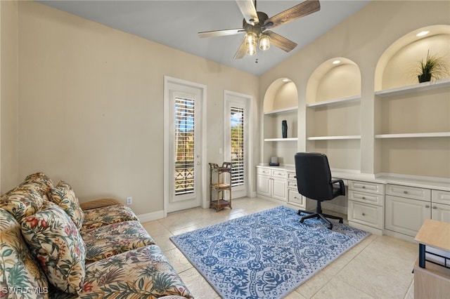 office with ceiling fan, built in desk, built in features, and light tile patterned floors