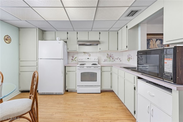 kitchen with decorative backsplash, a drop ceiling, light wood-type flooring, white cabinets, and white appliances