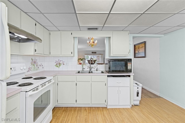 kitchen featuring white appliances, white cabinetry, sink, and light wood-type flooring