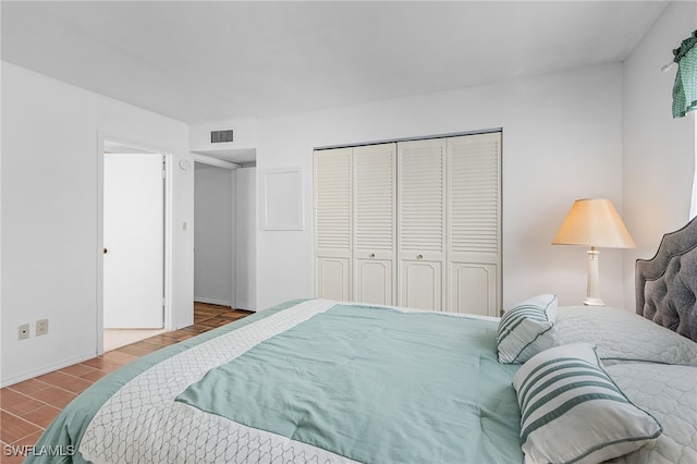 bedroom with a closet and hardwood / wood-style flooring