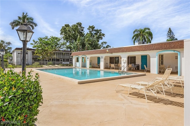 view of swimming pool featuring a patio area