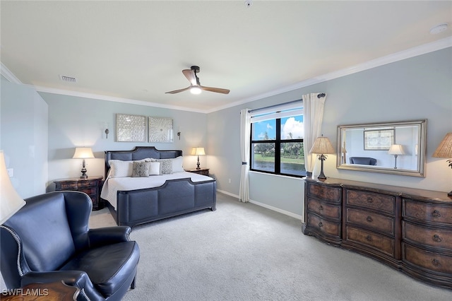 bedroom with crown molding, light colored carpet, and ceiling fan