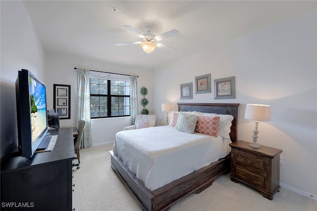 bedroom featuring light carpet and ceiling fan