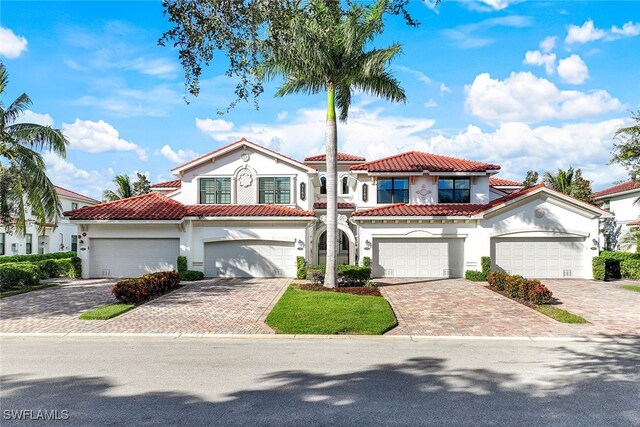 mediterranean / spanish house featuring a garage