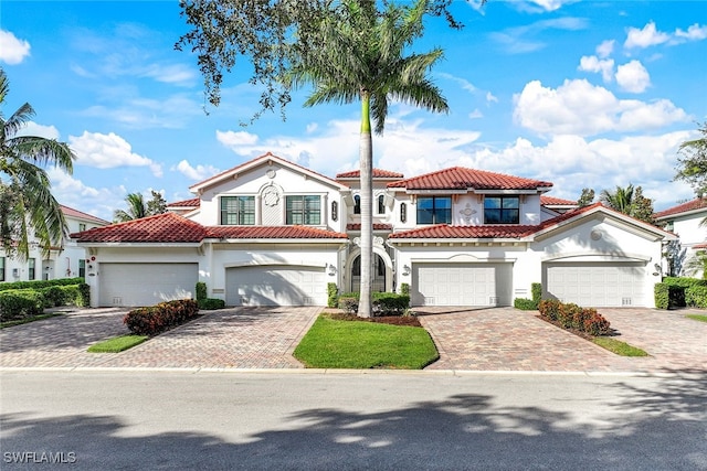 mediterranean / spanish-style home featuring a garage