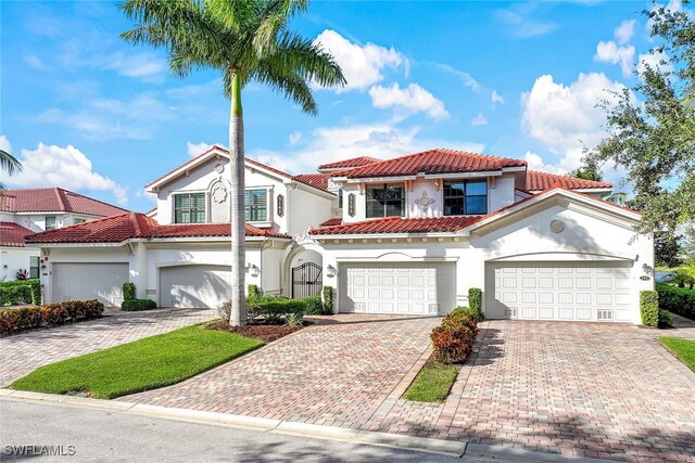 mediterranean / spanish-style home featuring a garage