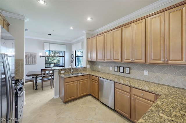 kitchen featuring appliances with stainless steel finishes, sink, stone countertops, kitchen peninsula, and pendant lighting