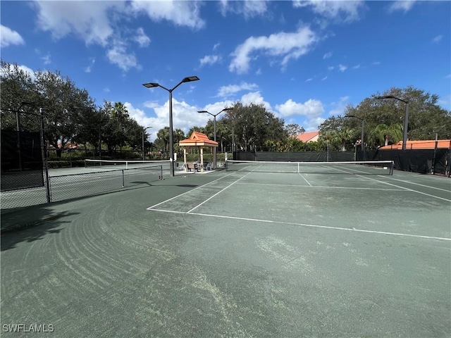 view of sport court with a gazebo