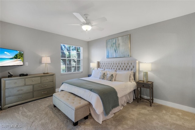 bedroom featuring ceiling fan and light colored carpet