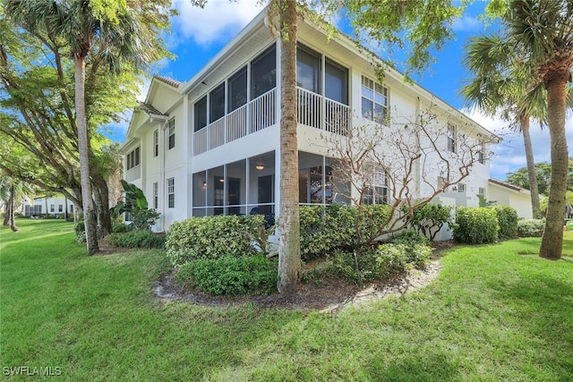 view of home's exterior featuring a yard